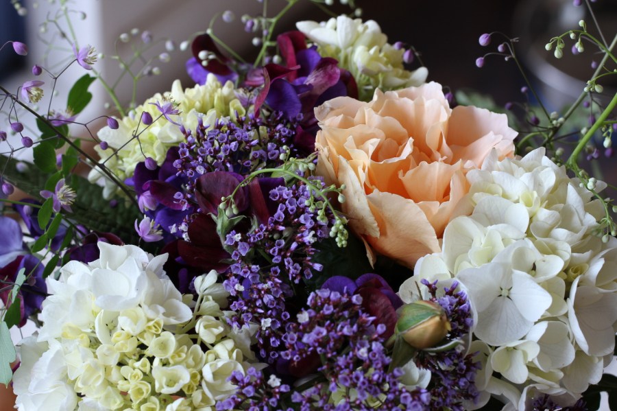 just joey rose with statice and hydrangeas